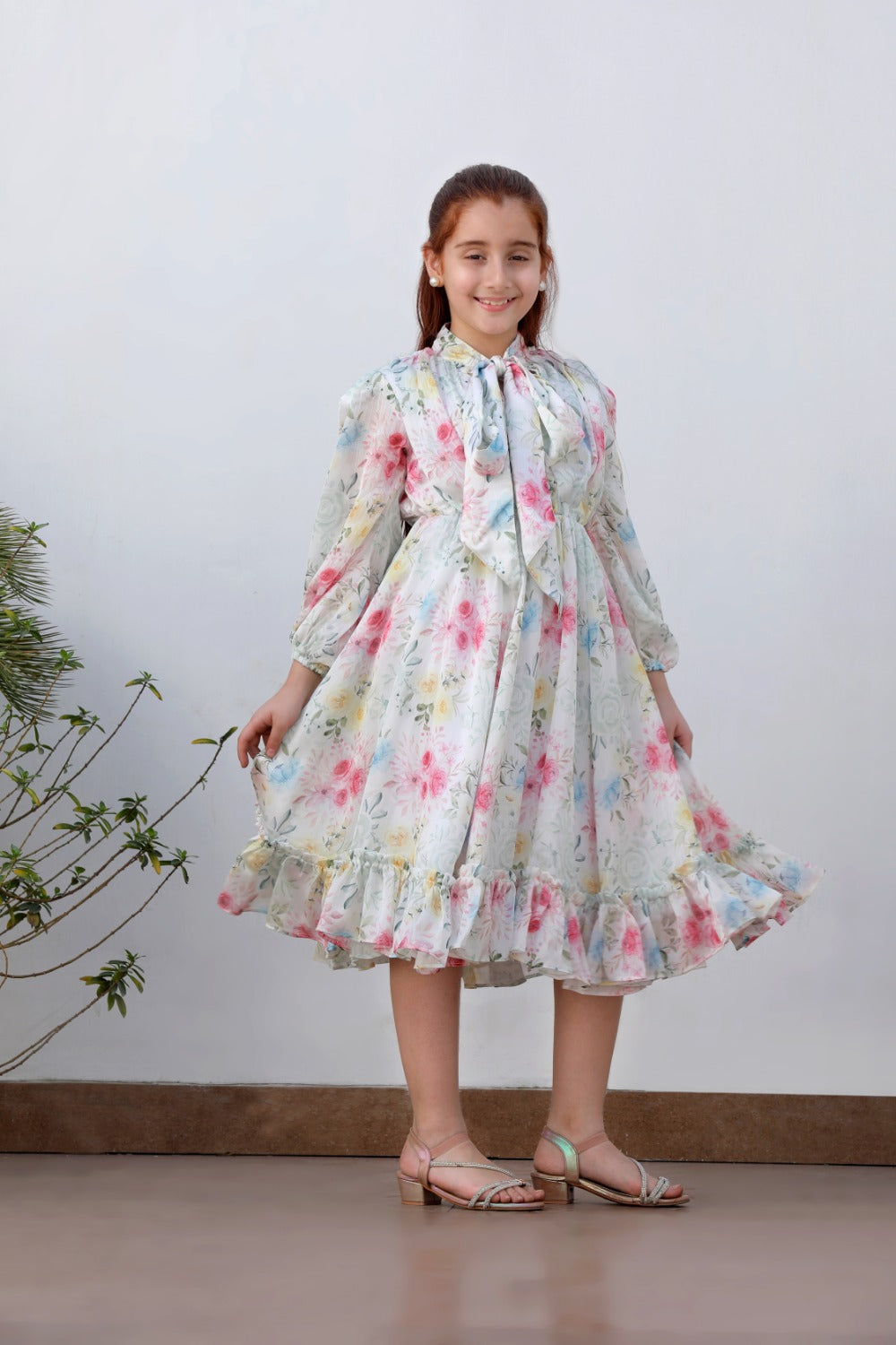 Full-length front view of white floral dress, alternate indoor angle