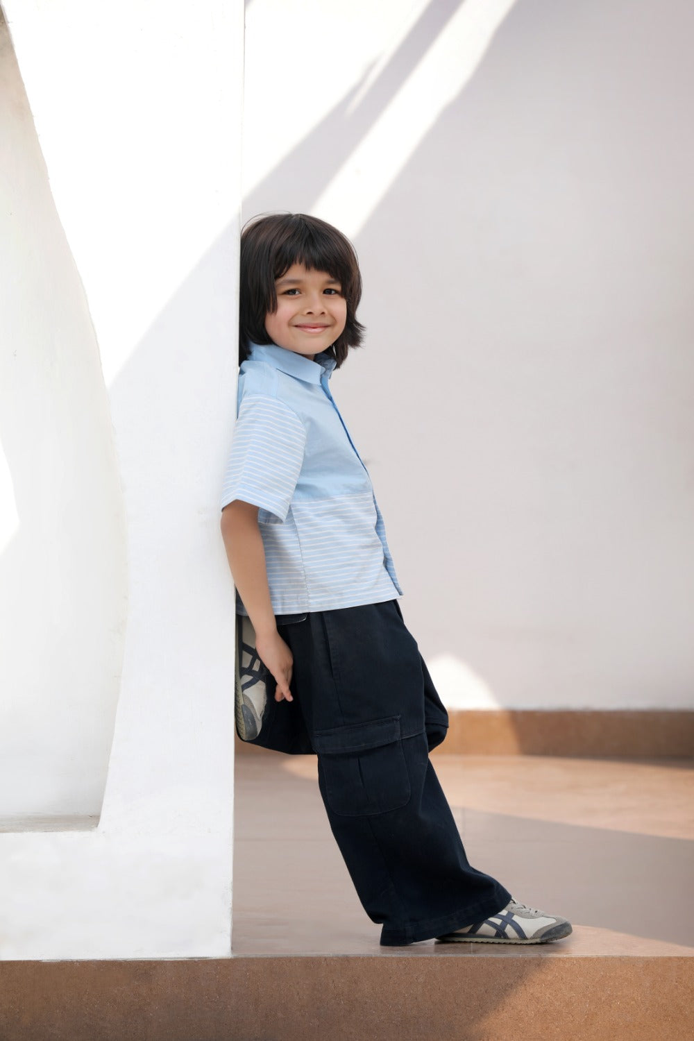 Luxe & Hardy Ash Blue Cargo Pants – side profile full length view of navy blue wide leg cargo pants, toddler boys ethnic casual bottom wear, cargo pocket side detail and relaxed fit