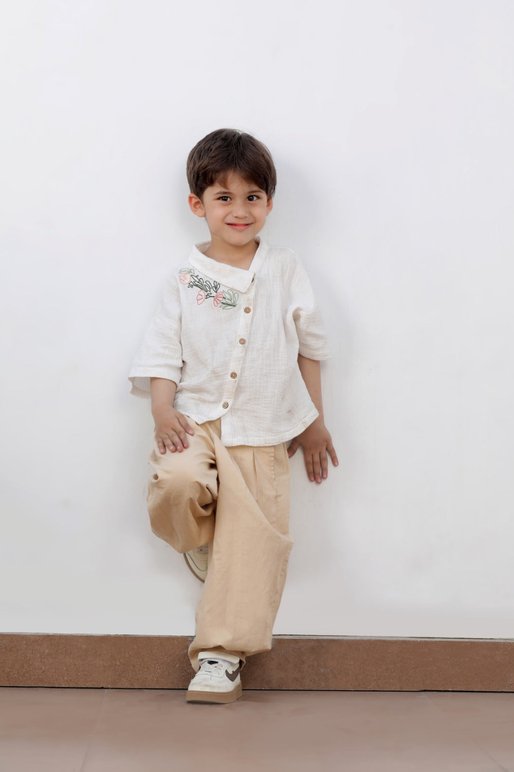 Luxe & Hardy Breathing Beige Pant – full length standing pose of beige wide leg palazzo pants for toddler boys, kids party wear ethnic bottom, festive outfit with white embroidered shirt