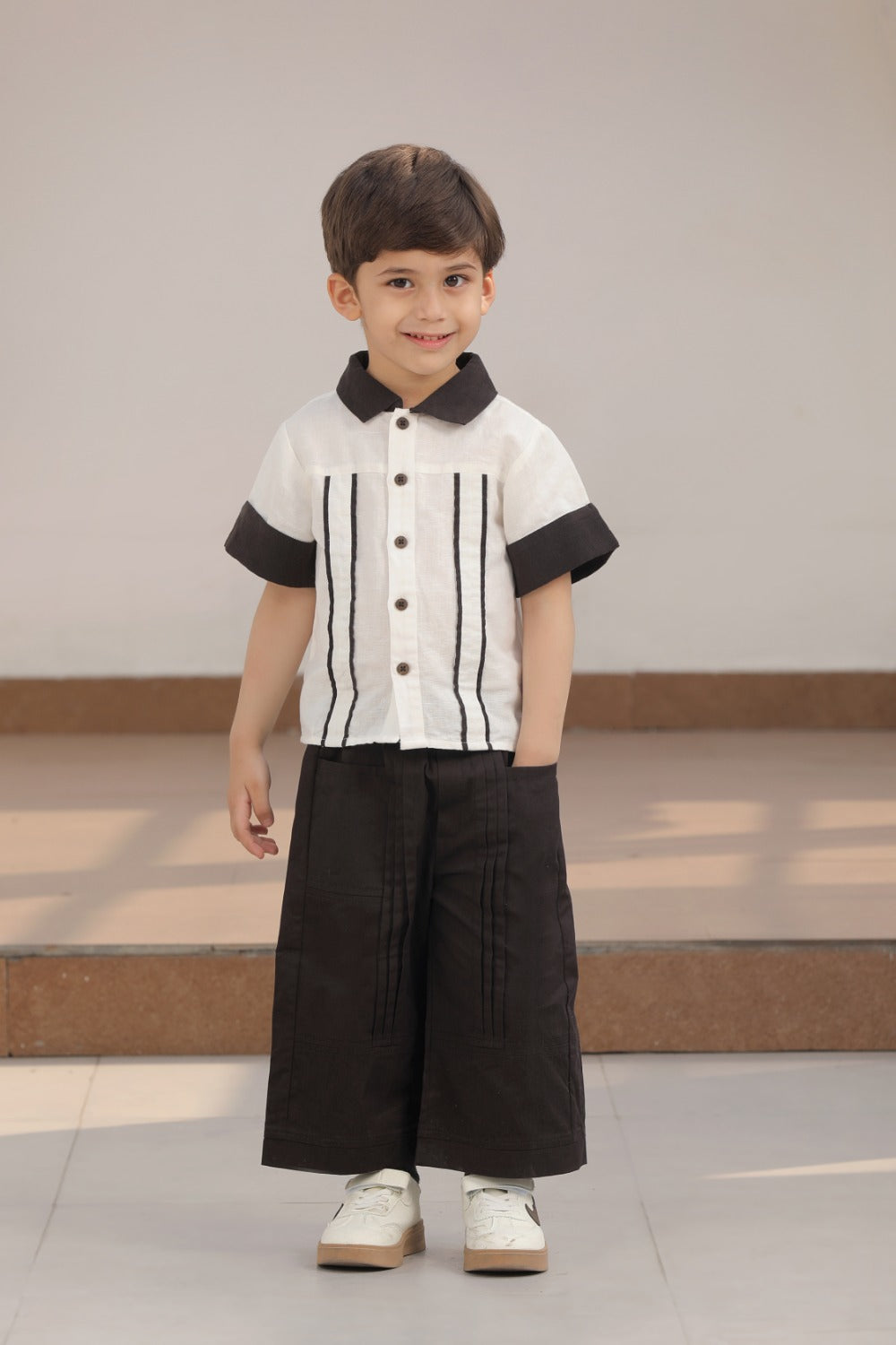 Luxe & Hardy Everwood Ensemble – full length front view of white black stripe short sleeve shirt and black wide leg palazzo pants co ord set for boys, toddler kids party wear ethnic outfit