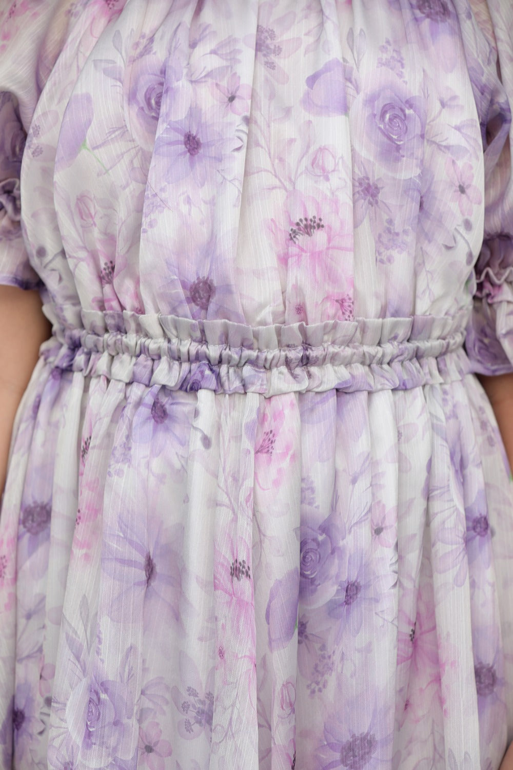 Close-up of lavender watercolour floral print on dress bodice and skirt