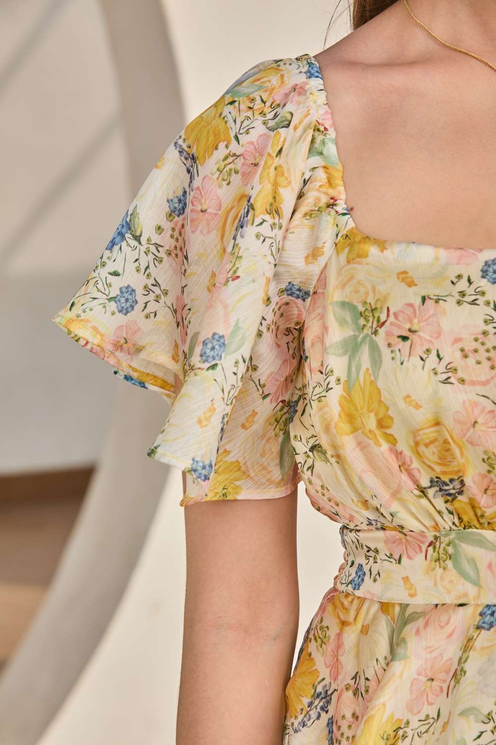 Luxe & Hardy Nora Flared Dress – close-up of yellow floral multi tiered ruffle maxi skirt, layered ruffle dress for women, cascading tier and flowy fabric detail