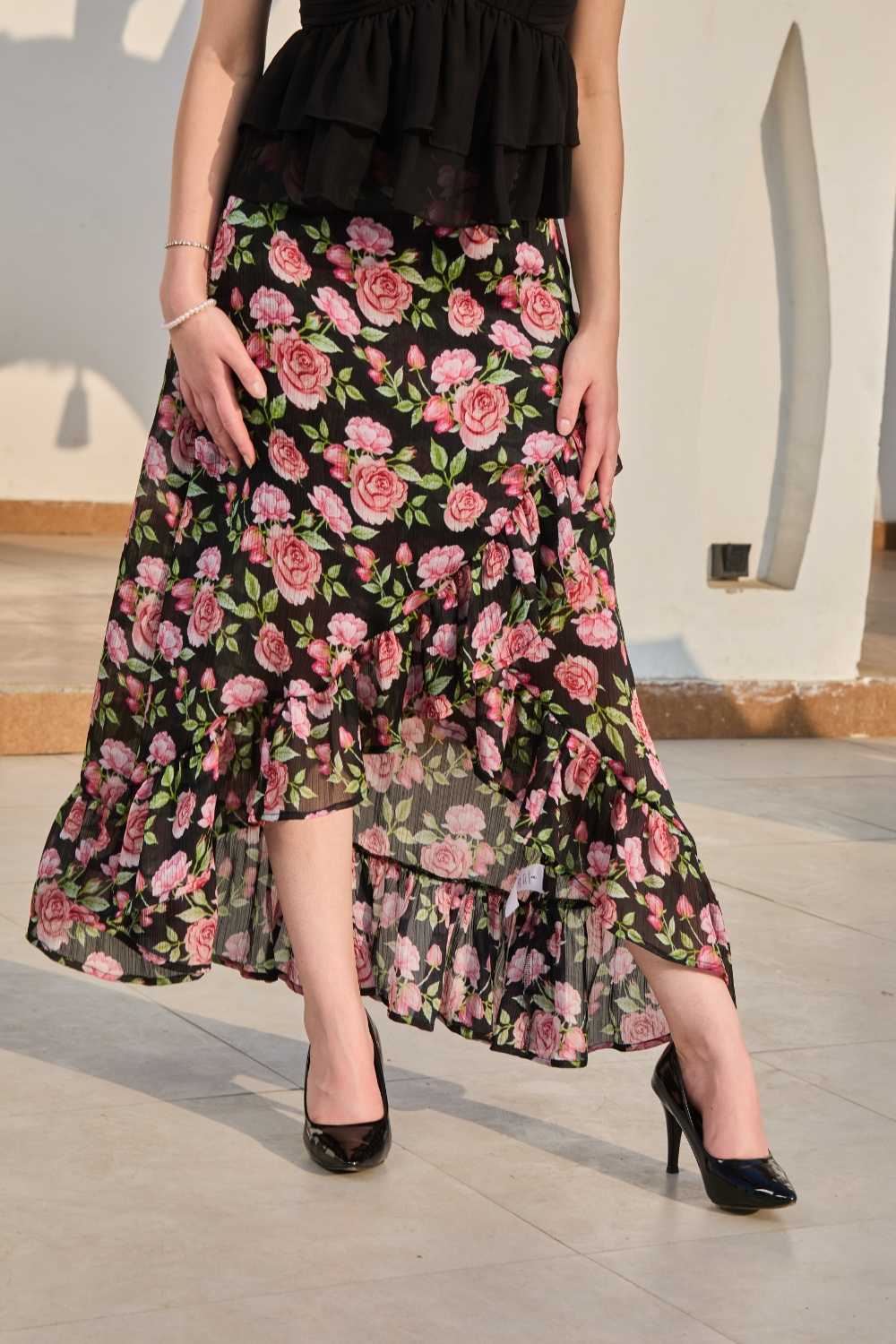 Luxe & Hardy Sera Rose Co-ord Set – side profile full length view, black rose floral cord set for women, sleeveless top and hi low wrap around maxi skirt