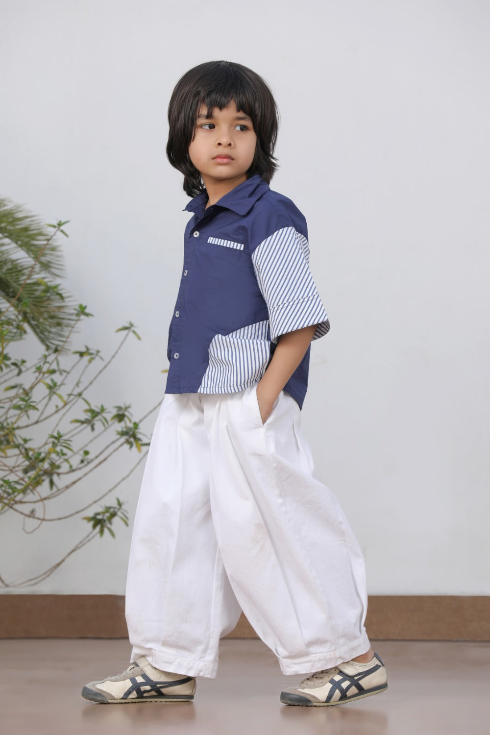 Luxe & Hardy Theo Blue Striped Shirt – side profile full length view of navy blue white stripe contrast panel short sleeve boys shirt, kids ethnic casual festive shirt with white wide leg pants