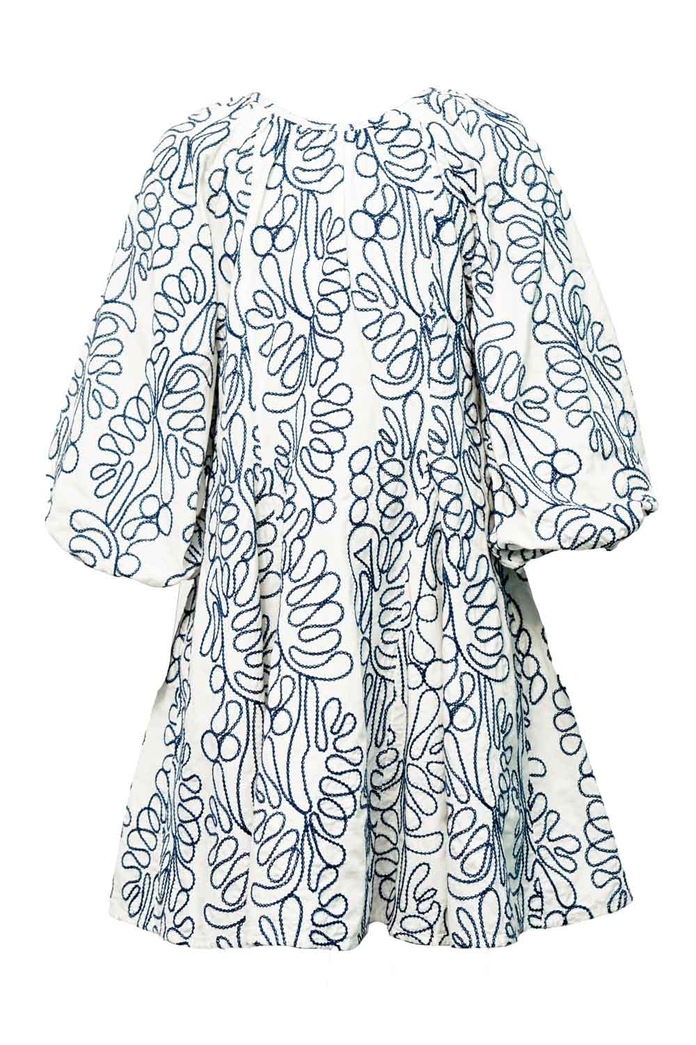 Flat lay of white tiered midi dress with blue block-print pattern