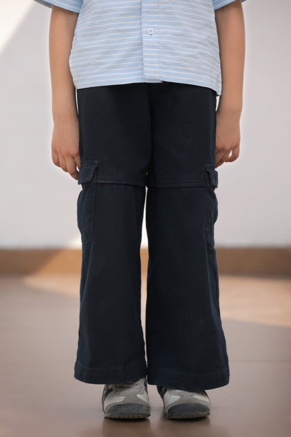 Luxe & Hardy Ash Blue Cargo Pants – full length white wall setting of navy blue wide leg cargo pants, boys ethnic casual bottom wear, styled with light blue short sleeve shirt