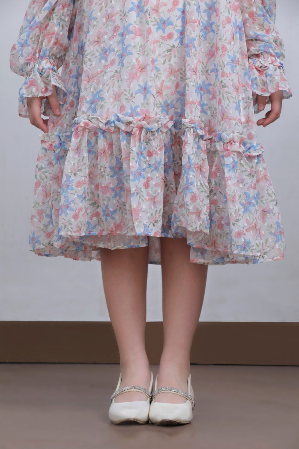 Full-length front view of white floral midi dress, alternate angle