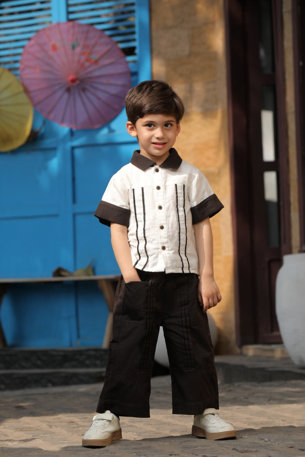 Luxe & Hardy Everwood Ensemble – full length outdoor shot of white black pinstripe boys shirt and black wide leg pants, toddler kids party wear co ord set, festive ethnic outfit