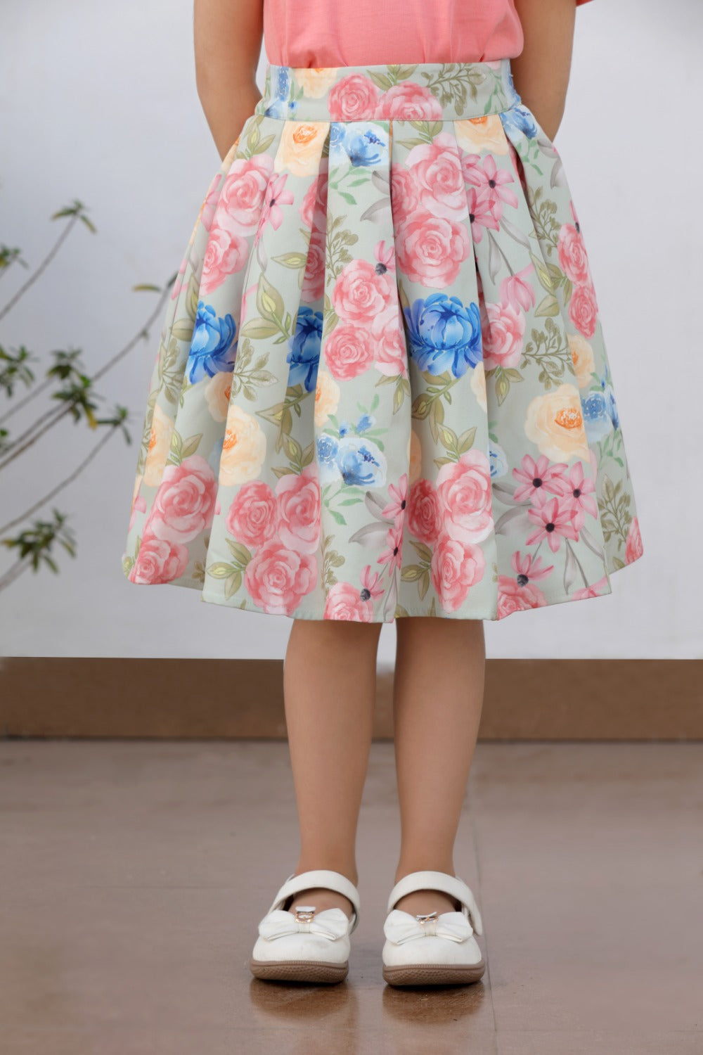 Close-up of colorful floral print on flared midi skirt