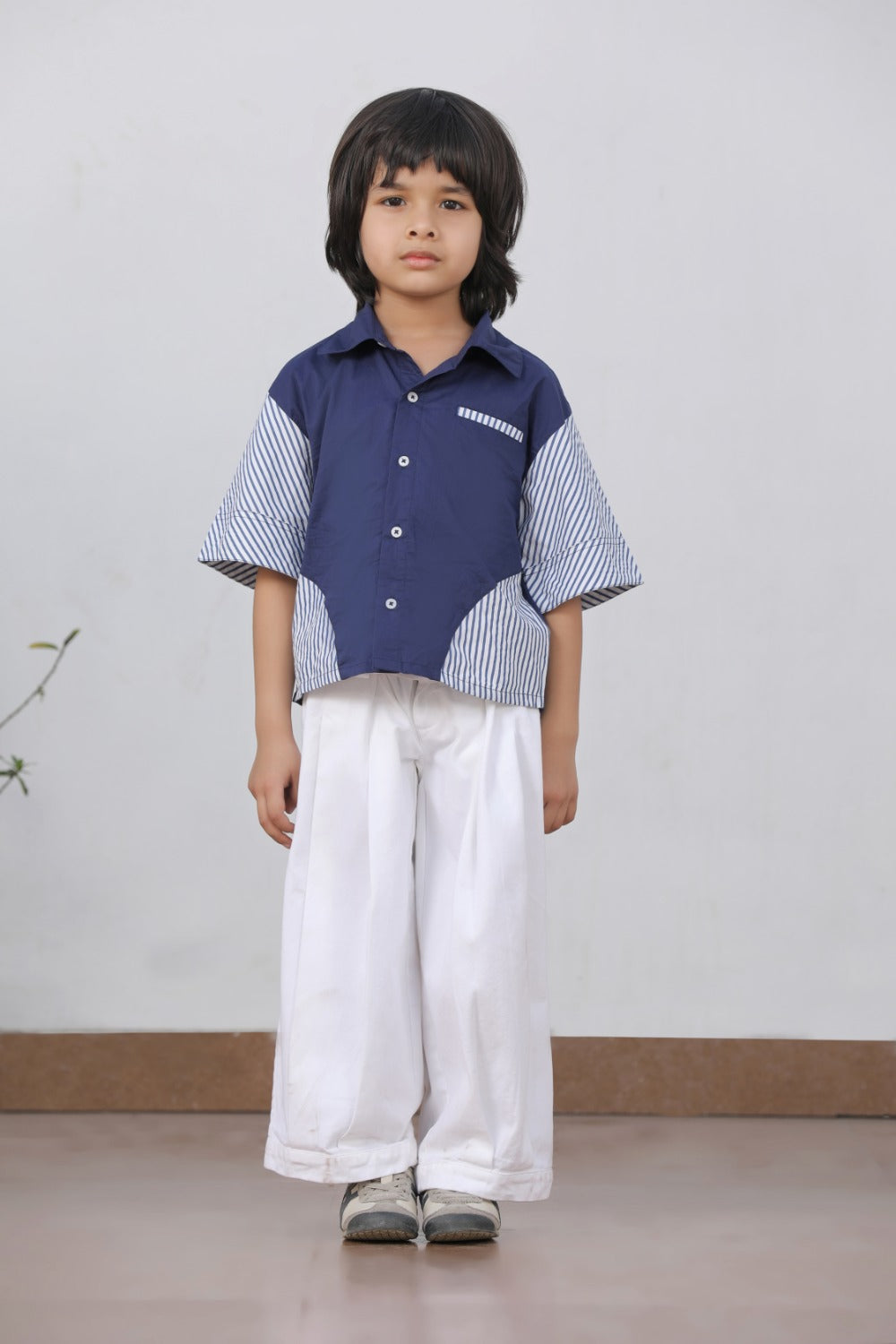 Luxe & Hardy Theo Blue Striped Shirt – three-quarter view of navy blue white stripe contrast panel short sleeve boys shirt, kids ethnic festive casual shirt, styled with white wide leg relaxed pants
