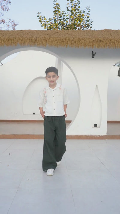 Luxe & Hardy Charles Relaxed Pants – video of black wide leg relaxed linen boys pants in motion styled with white shirt, play to see full kids ethnic casual bottom wear styling