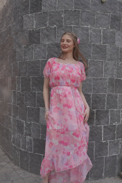 Luxe & Hardy Ivy Ruffle Dress – video of pink floral off shoulder ruffle maxi dress for women in motion, play to see full dress styling and flow