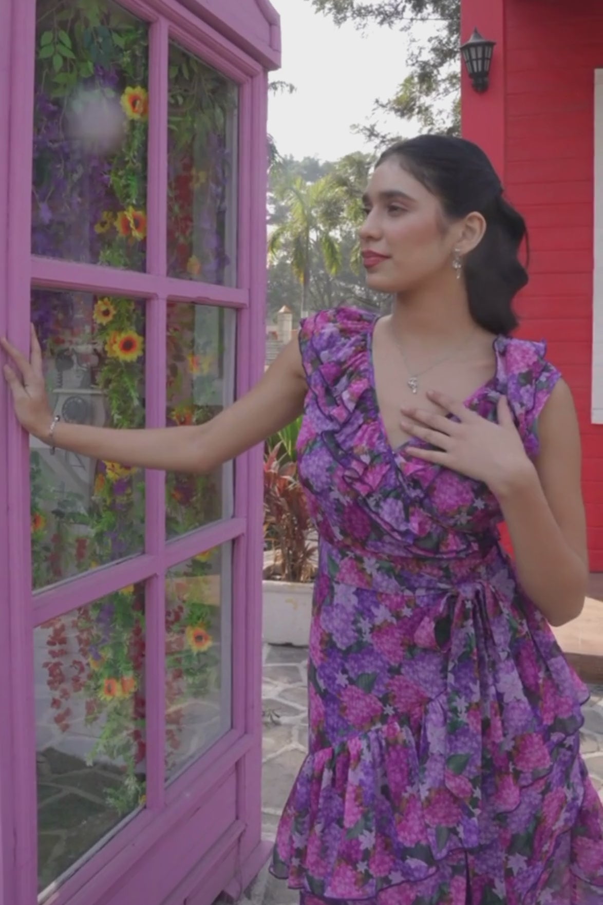 Luxe & Hardy Polly Ruffle Dress – video of purple pink floral v neck ruffle midi dress for women in motion, play to see full dress styling and hi low hem flow