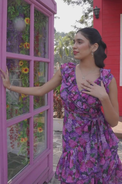 Luxe & Hardy Polly Ruffle Dress – video of purple pink floral v neck ruffle midi dress for women in motion, play to see full dress styling and hi low hem flow