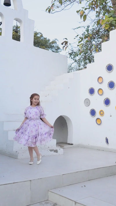 Girl in lavender floral midi dress in outdoor courtyard setting — video preview