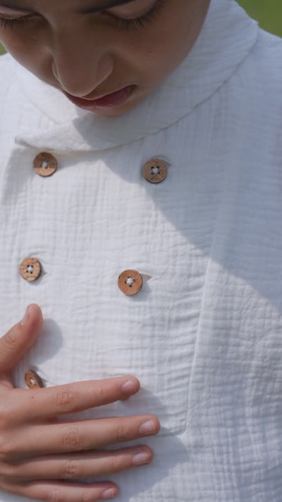 Luxe & Hardy Milo Textured Tee – video of white textured linen double button boys shirt in motion, play to see full kids ethnic party wear casual shirt styling