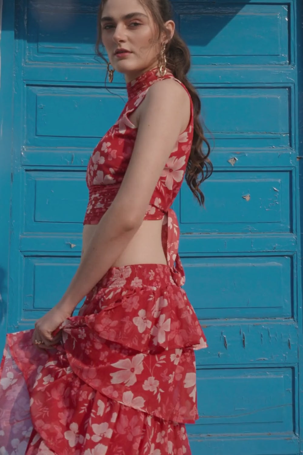 Luxe & Hardy Bria Co-ord Set Ruby – video of ruby red floral halter crop top and tiered ruffle maxi skirt co ord set for women in motion, play to see full styling