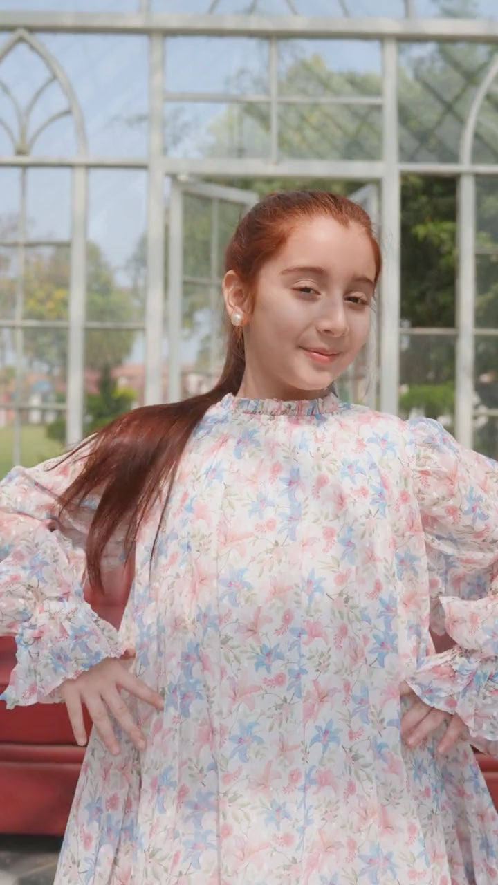 Girl in white floral long-sleeve tiered dress, styled close-up — video preview