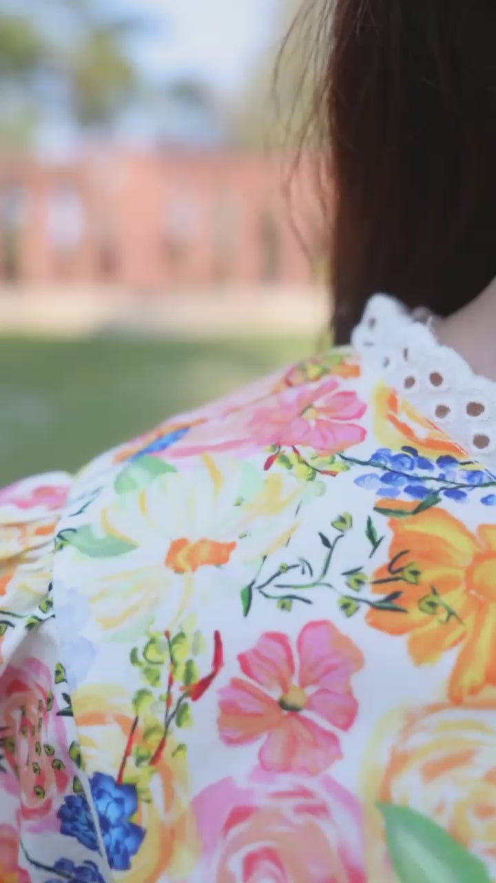 Girl in floral co-ord set outdoors — video preview